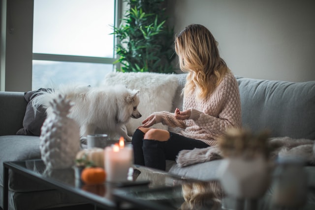 woman and dog in living room